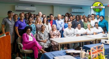 Large group photograph of health care staff from SVG and NHSE